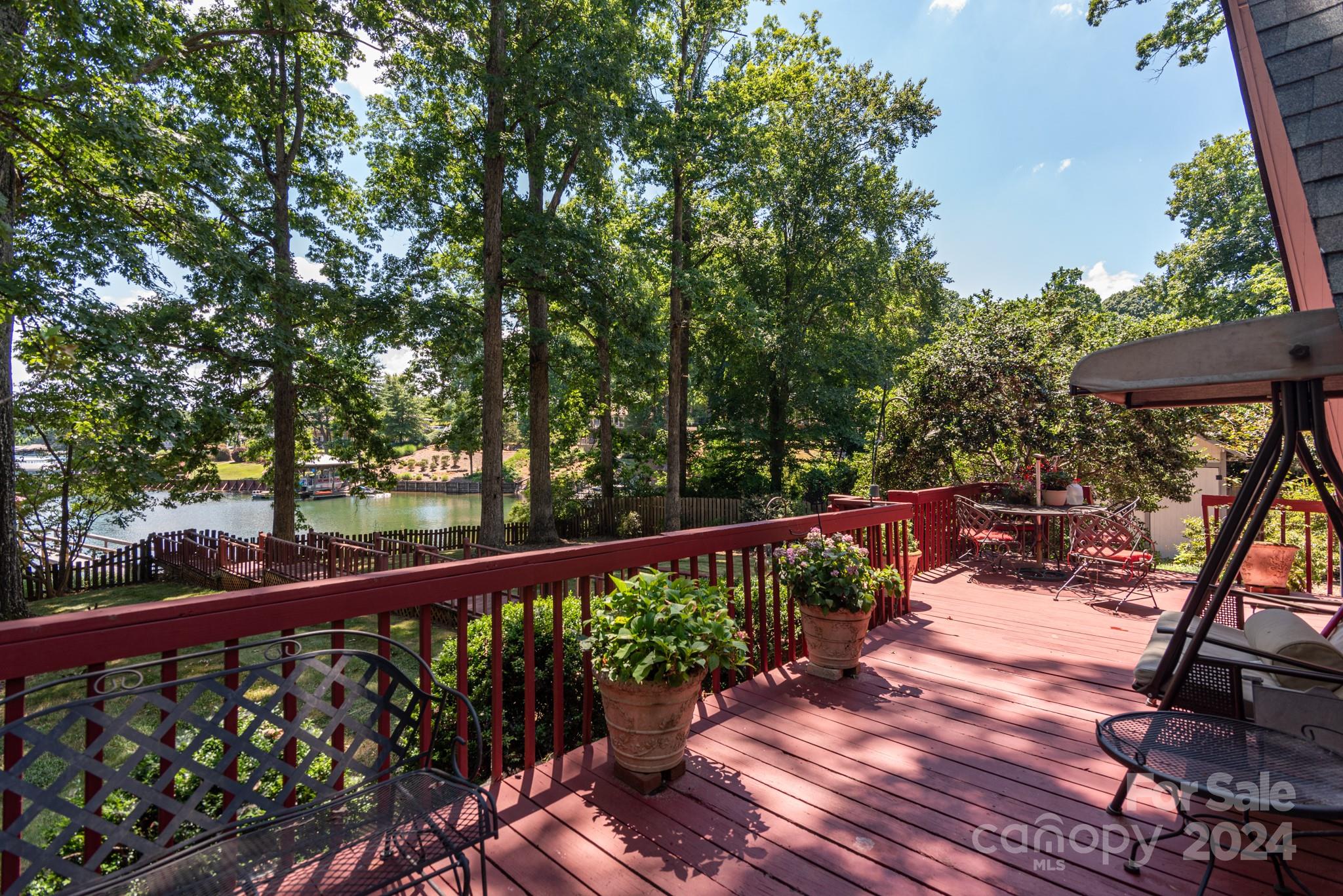 2726 Lake Shore Road South Denver, NC 28037 - Photo 28 of 48 a view of a balcony with wooden floor and outdoor seating