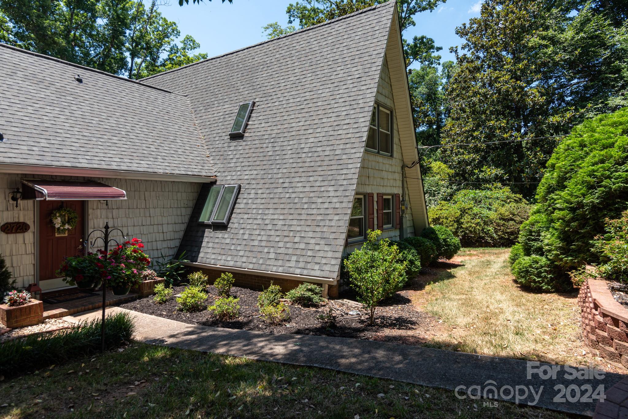 2726 Lake Shore Road South Denver, NC 28037 - Photo 38 of 48 a front view of a house with a yard