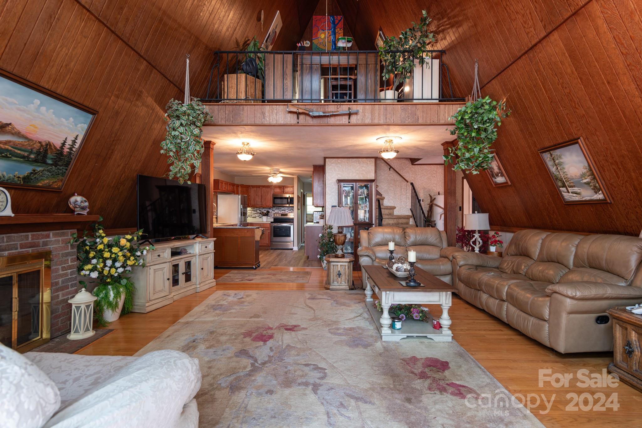 2726 Lake Shore Road South Denver, NC 28037 - Photo 7 of 48 a living room with furniture and a fireplace