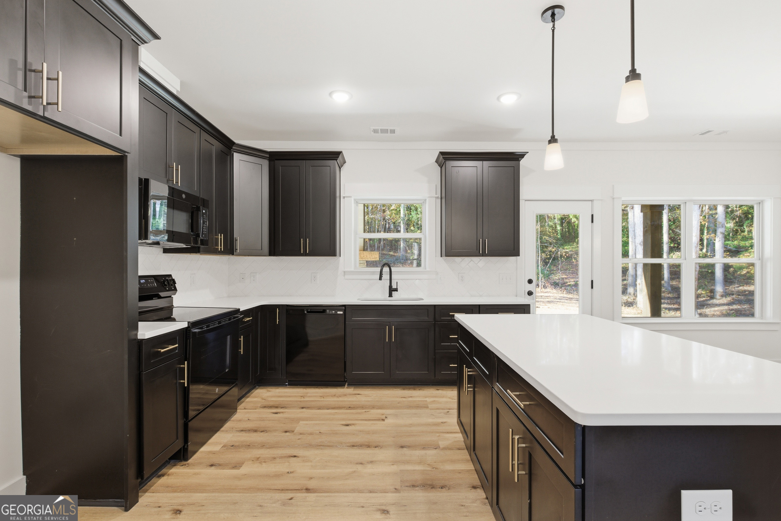 405 Ayers Creek Drive Toccoa, GA 30577 - Photo 11 of 35 a kitchen with stainless steel appliances granite countertop a sink a stove and a refrigerator