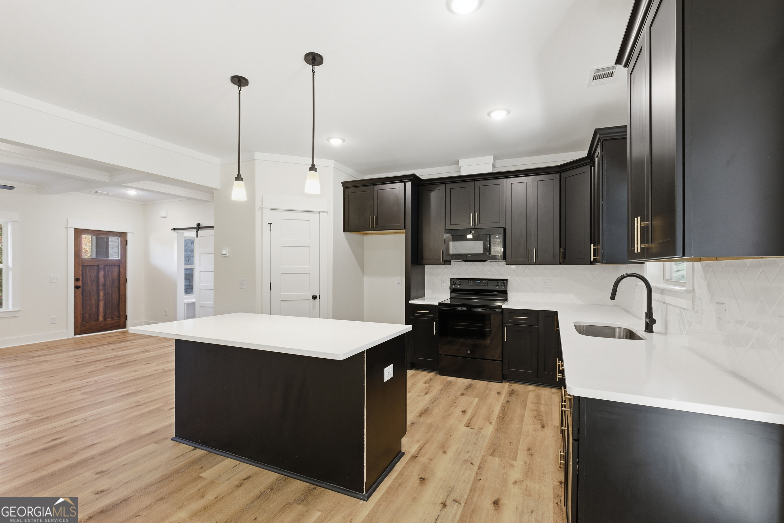 405 Ayers Creek Drive Toccoa, GA 30577 - Photo 12 of 35 a large kitchen with kitchen island a sink stainless steel appliances and cabinets