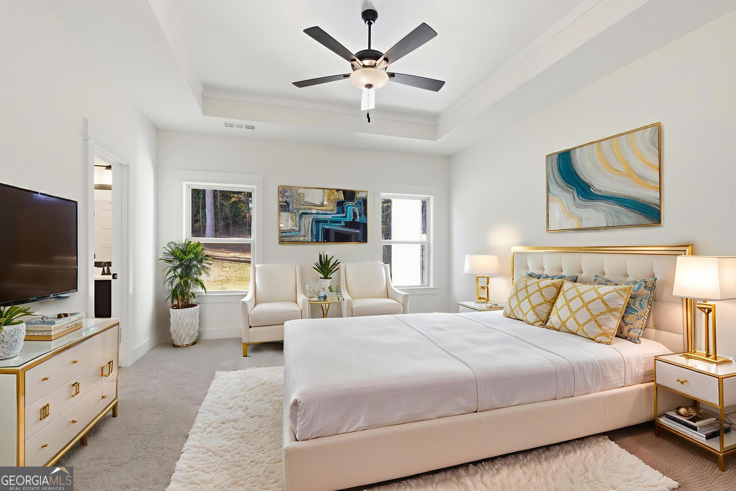 405 Ayers Creek Drive Toccoa, GA 30577 - Photo 13 of 35 a bedroom with a bed a flat screen tv and couches