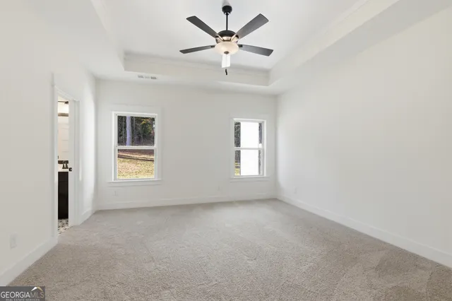 a view of an empty room with a window