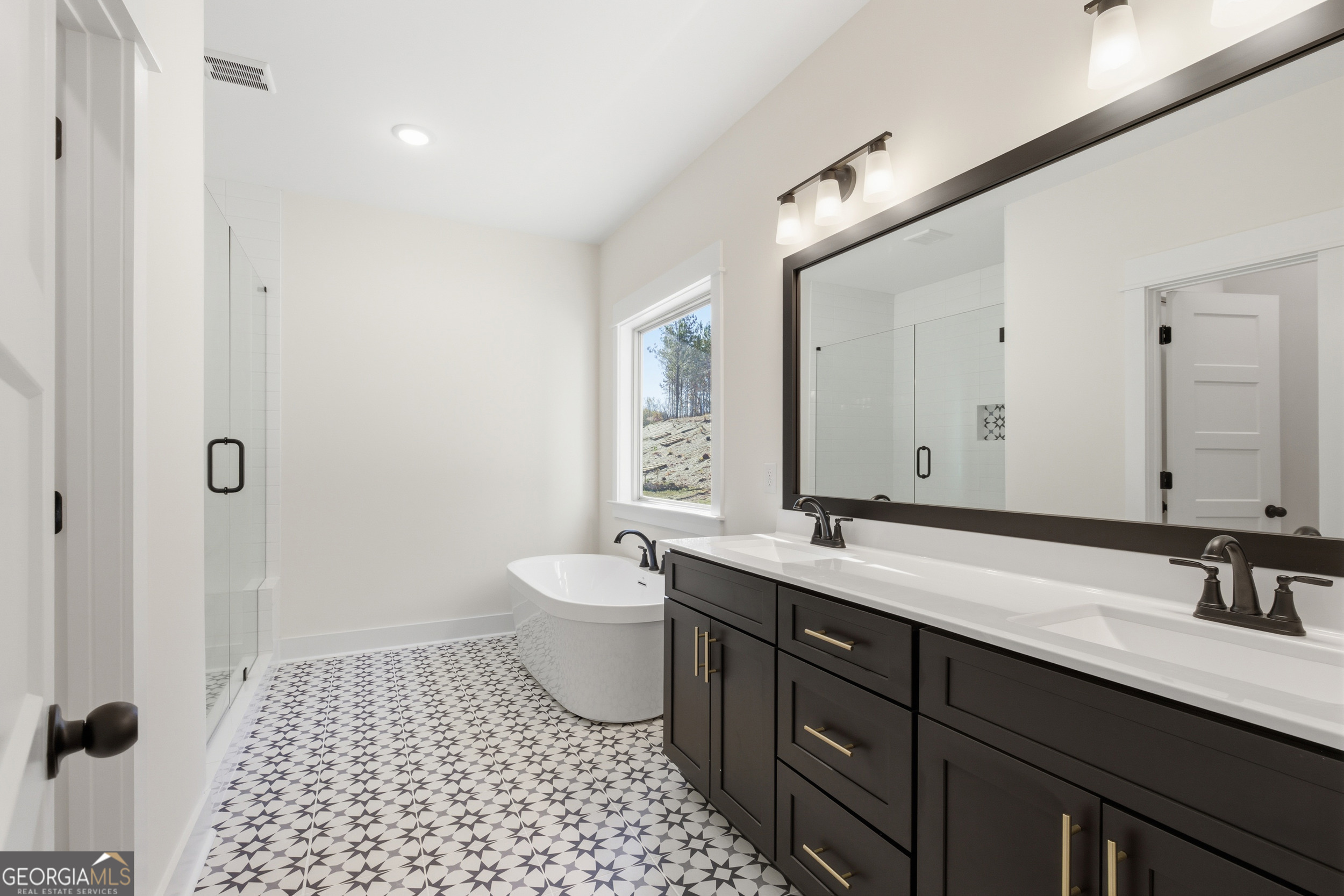 405 Ayers Creek Drive Toccoa, GA 30577 - Photo 16 of 35 a bathroom with a sink and a mirror