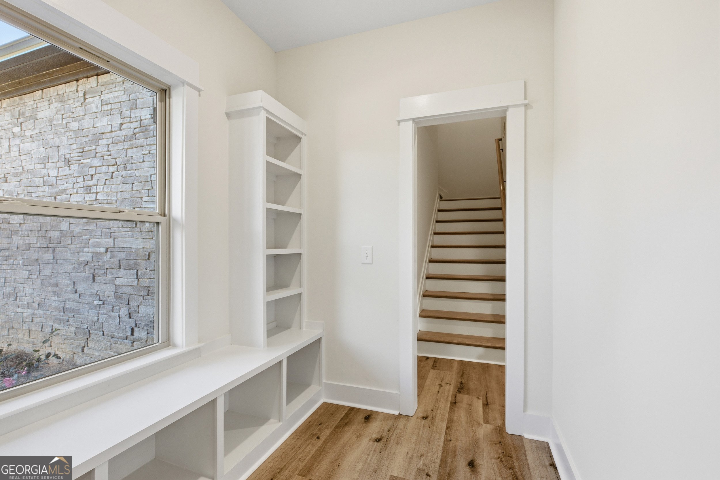 405 Ayers Creek Drive Toccoa, GA 30577 - Photo 24 of 35 a view of a room with wooden floor and windows