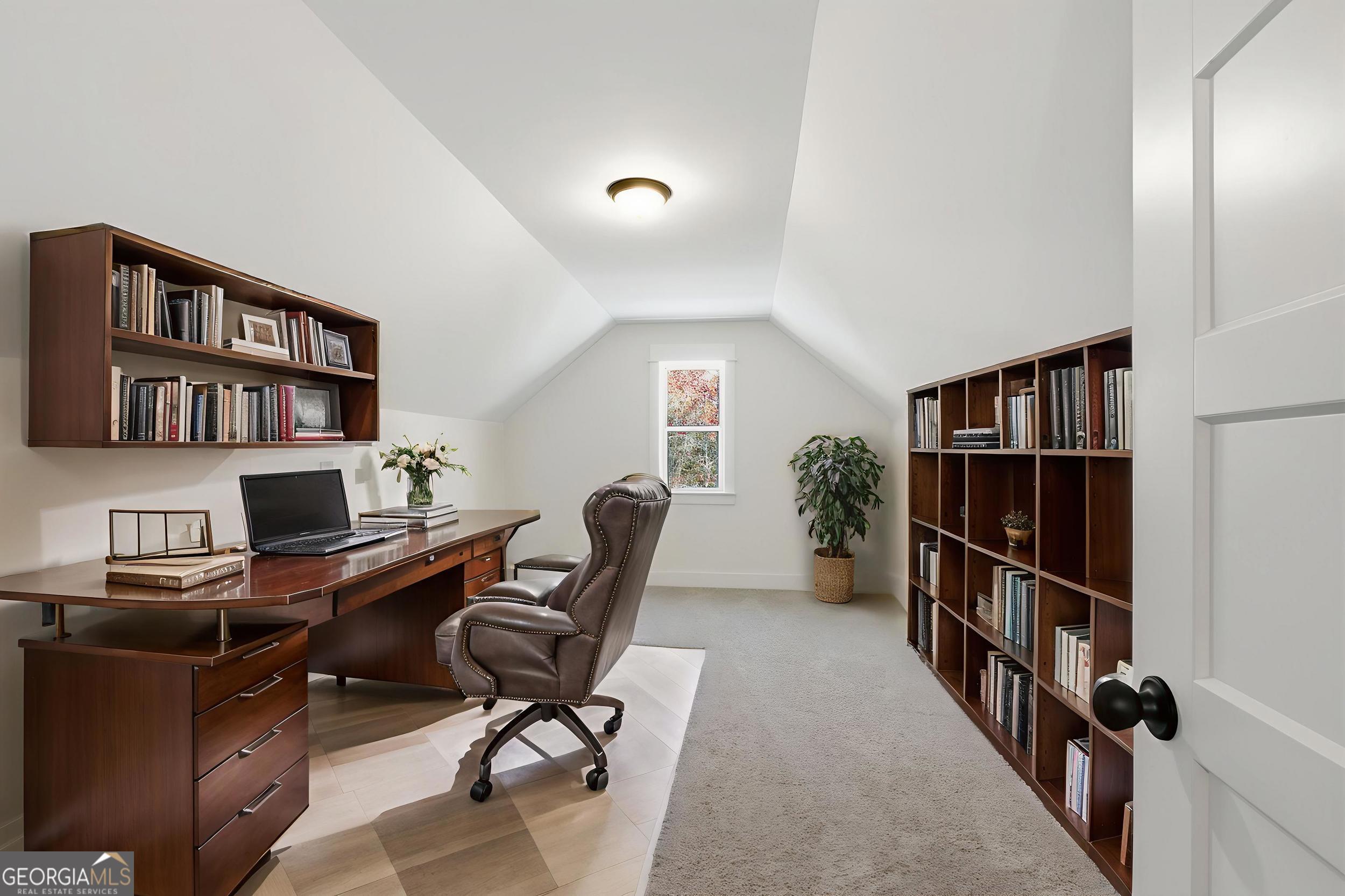 405 Ayers Creek Drive Toccoa, GA 30577 - Photo 28 of 35 a view of a workspace with furniture and a bookshelf