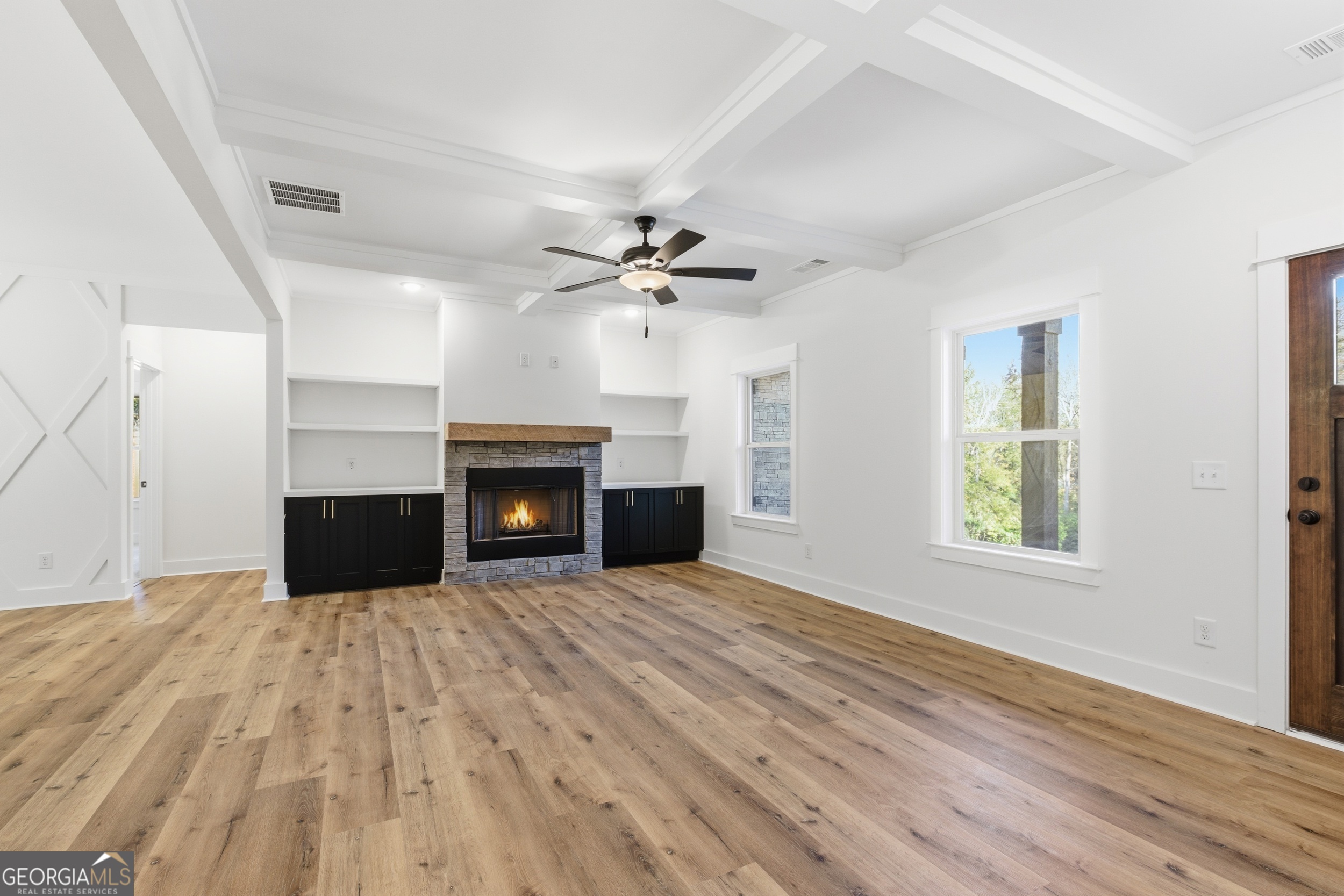 405 Ayers Creek Drive Toccoa, GA 30577 - Photo 8 of 35 wooden floor fireplace and windows in a room
