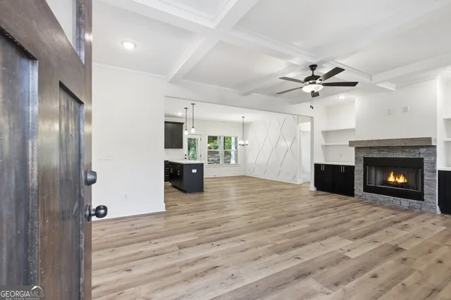 wooden floor fireplace and windows in a room
