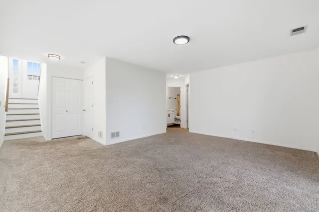 an empty room with entrance door