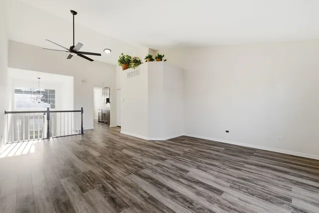 a view of a room with wooden floor