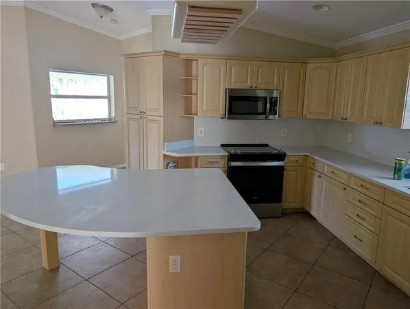 a kitchen with a refrigerator and a sink