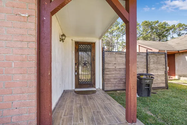 a view of a porch with wooden floor and outer view