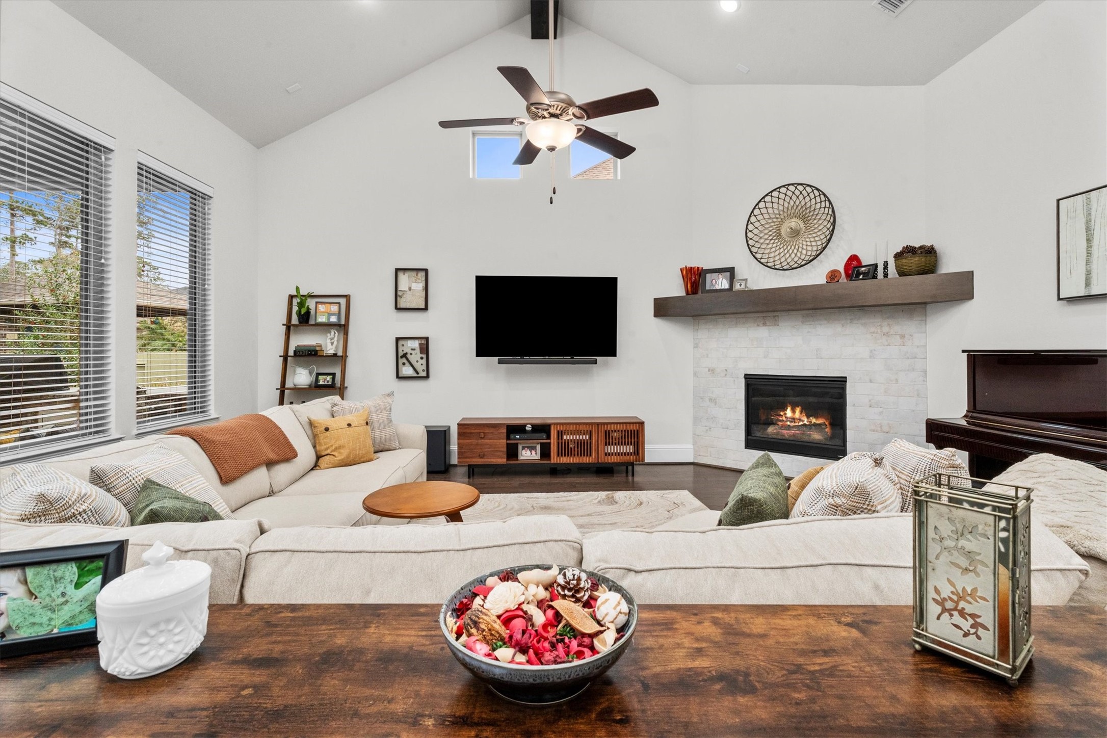 106 Amber Jade Court Conroe, TX 77304 - Photo 14 of 50 a living room with furniture a fireplace and a flat screen tv