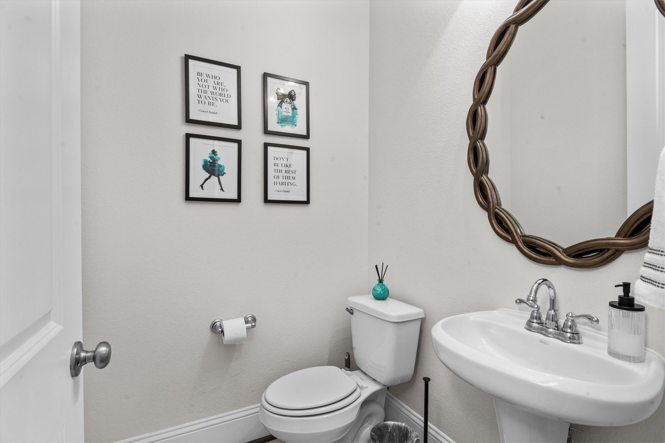 106 Amber Jade Court Conroe, TX 77304 - Photo 15 of 50 a bathroom with a toilet sink and mirror