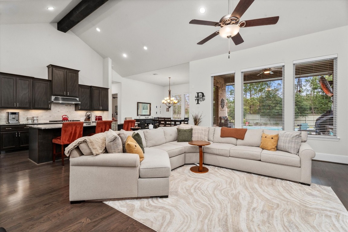106 Amber Jade Court Conroe, TX 77304 - Photo 16 of 50 a living room with furniture kitchen view and a large window