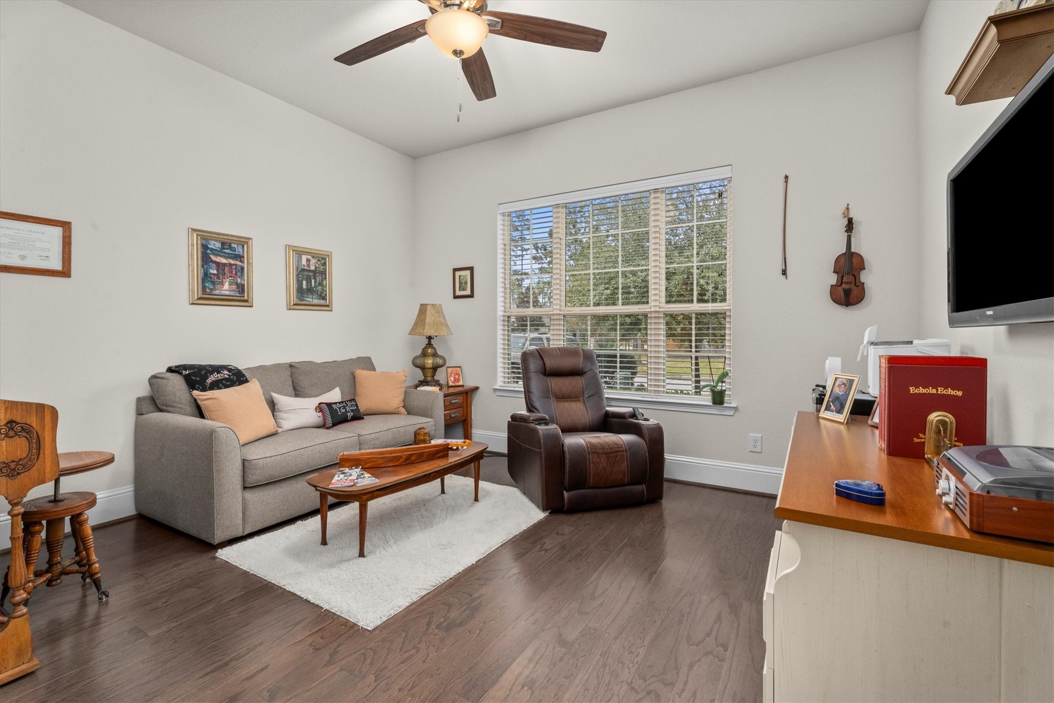 106 Amber Jade Court Conroe, TX 77304 - Photo 17 of 50 a living room with furniture and a flat screen tv
