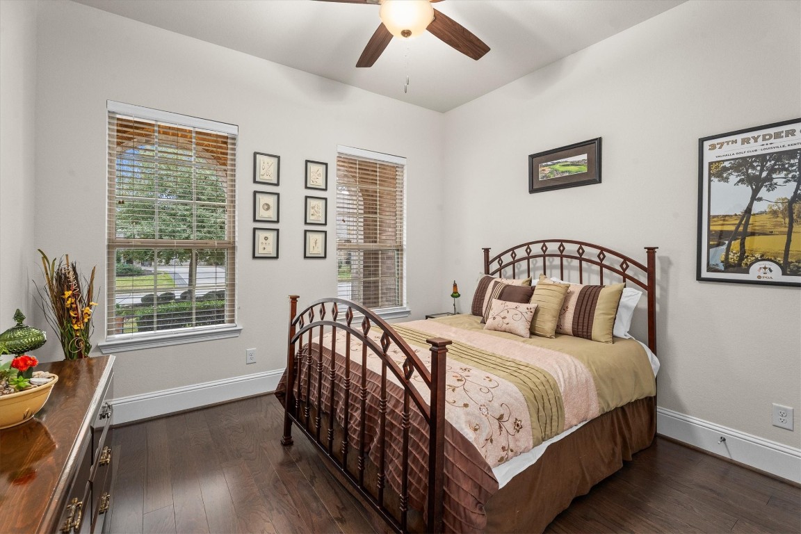 106 Amber Jade Court Conroe, TX 77304 - Photo 19 of 50 a bedroom with a bed and a window