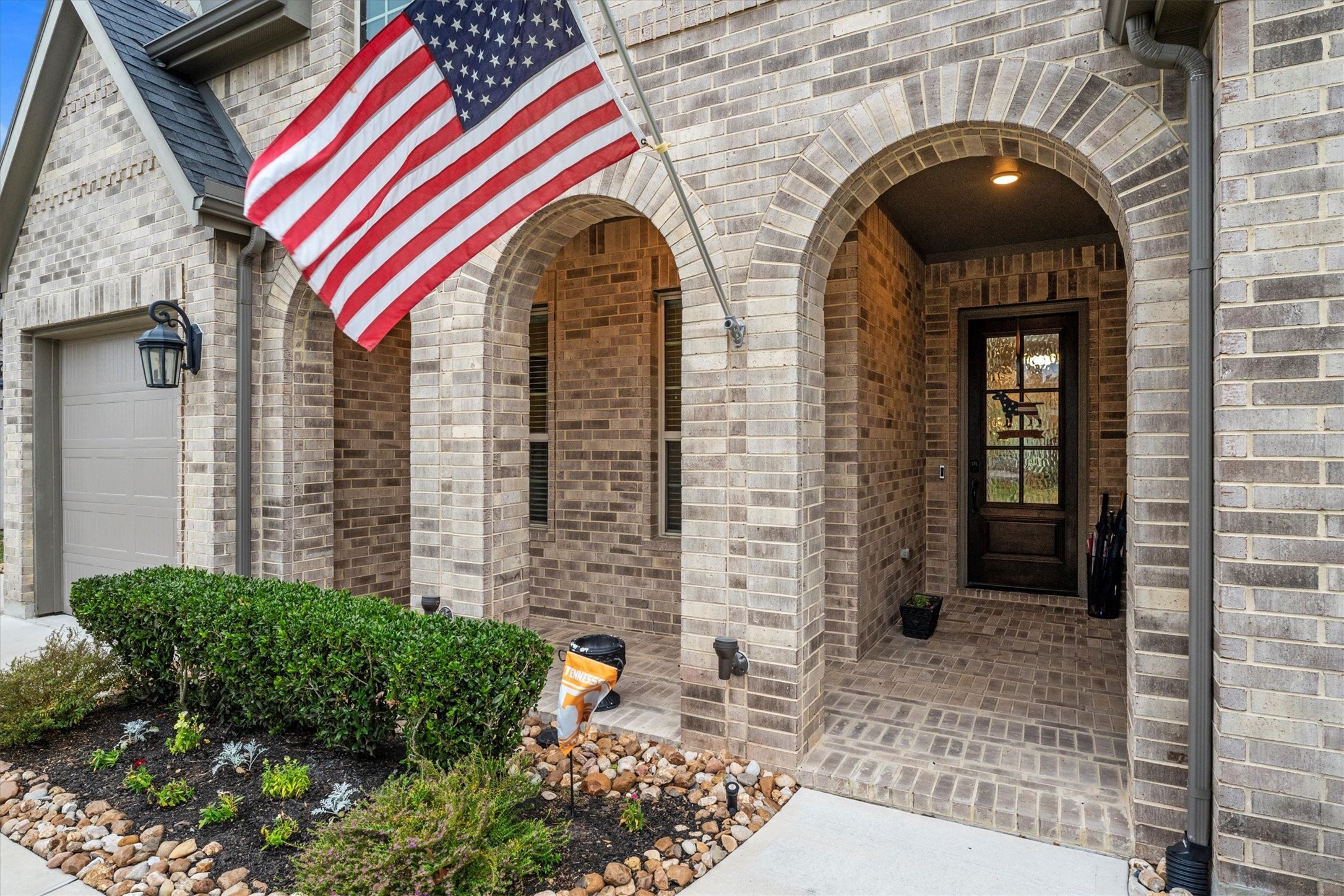 106 Amber Jade Court Conroe, TX 77304 - Photo 2 of 50 Beautiful entry with covered brick porch