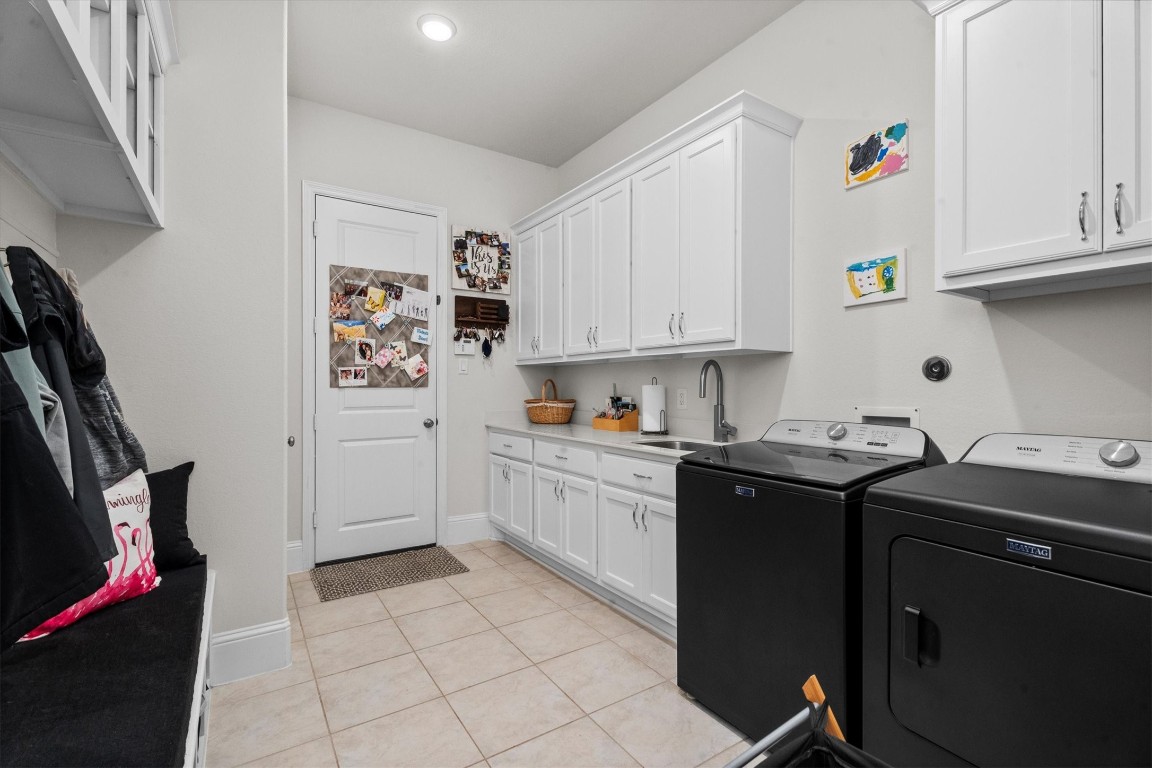 106 Amber Jade Court Conroe, TX 77304 - Photo 23 of 50 a kitchen with stainless steel appliances granite countertop a sink stove and cabinets