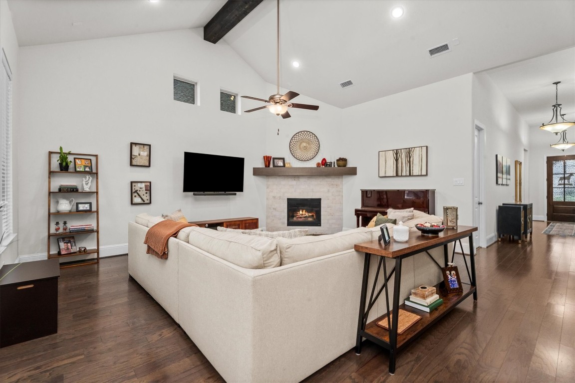 106 Amber Jade Court Conroe, TX 77304 - Photo 24 of 50 a living room with fireplace furniture and a flat screen tv