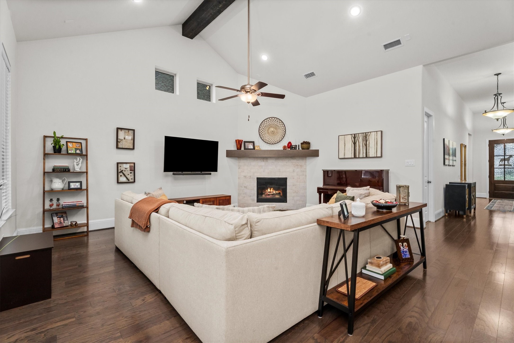 106 Amber Jade Court Conroe, TX 77304 - Photo 24 of 50 a living room with fireplace furniture and a flat screen tv