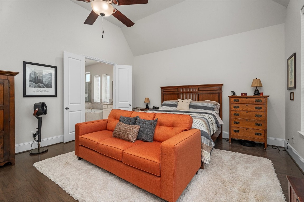 106 Amber Jade Court Conroe, TX 77304 - Photo 27 of 50 a bedroom with furniture and a bed