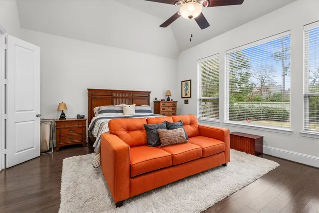 a living room with fireplace furniture and a large window