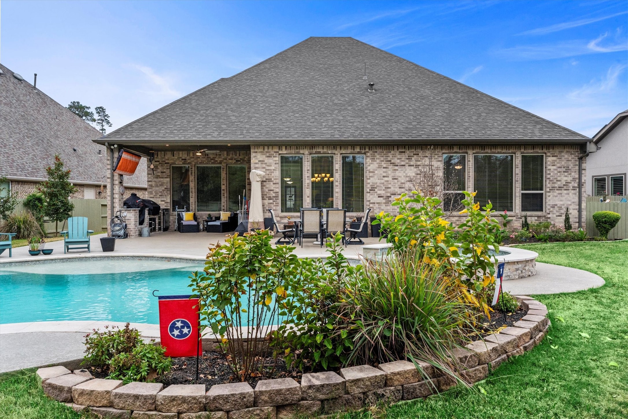 106 Amber Jade Court Conroe, TX 77304 - Photo 33 of 50 a front view of a house with garden