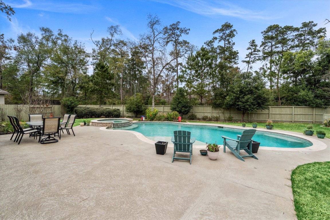106 Amber Jade Court Conroe, TX 77304 - Photo 34 of 50 a view of a bench with sitting area