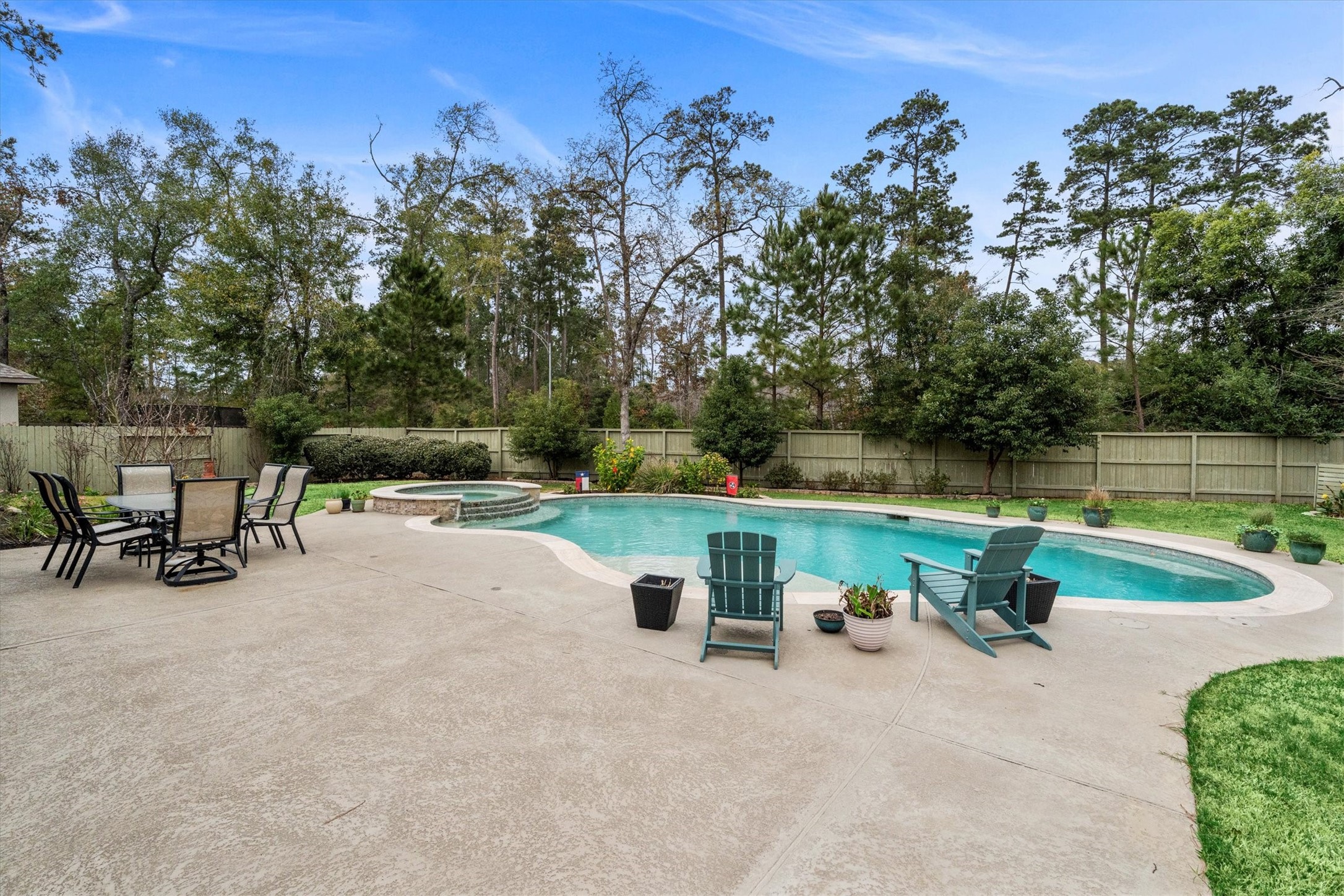 106 Amber Jade Court Conroe, TX 77304 - Photo 34 of 50 a view of a bench with sitting area