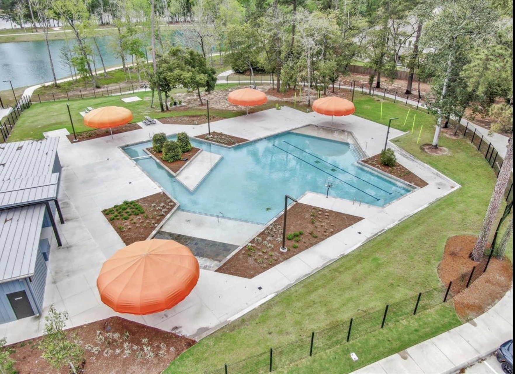 106 Amber Jade Court Conroe, TX 77304 - Photo 46 of 50 swimming pool with outdoor seating