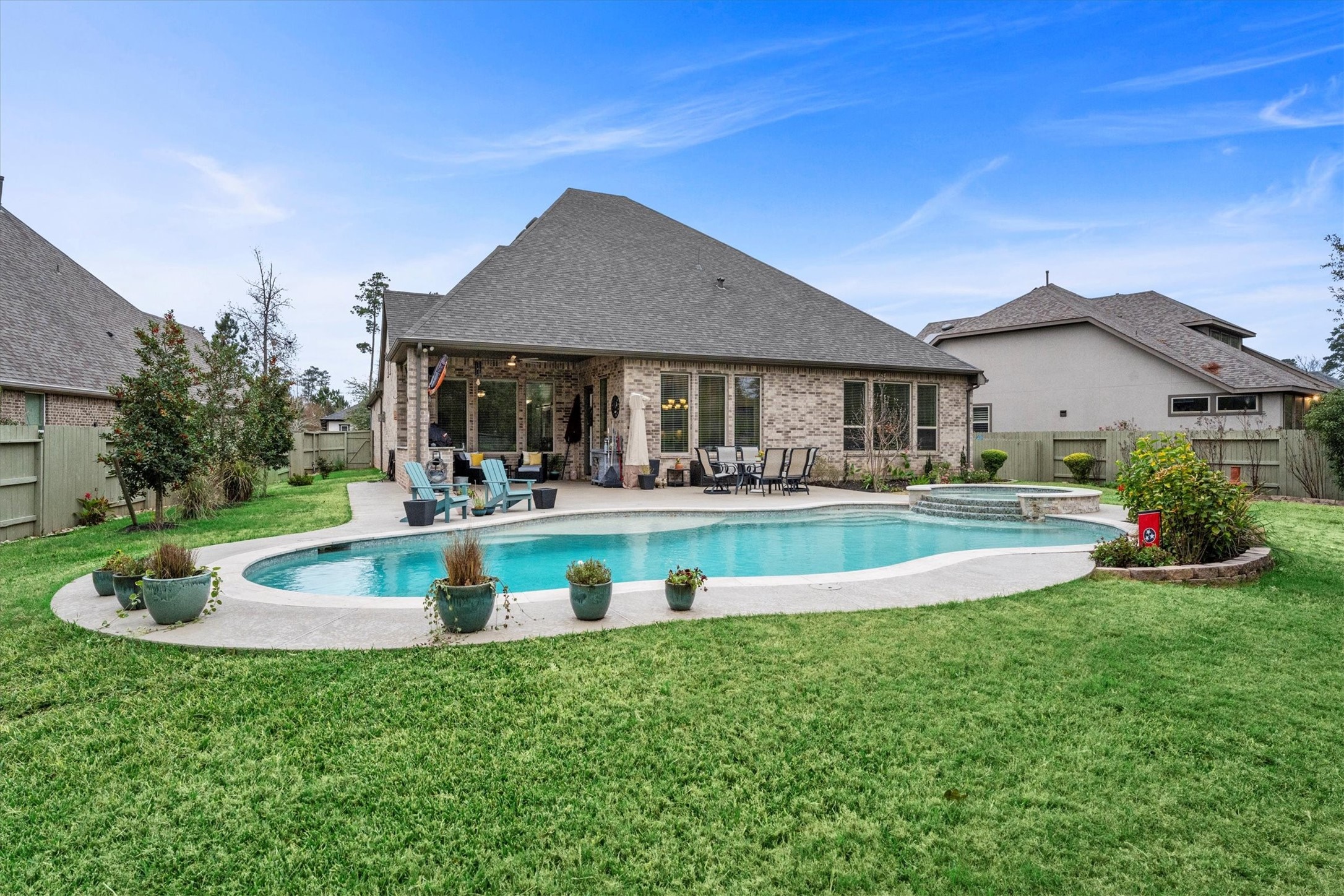106 Amber Jade Court Conroe, TX 77304 - Photo 48 of 50 a view of a house with a swimming pool