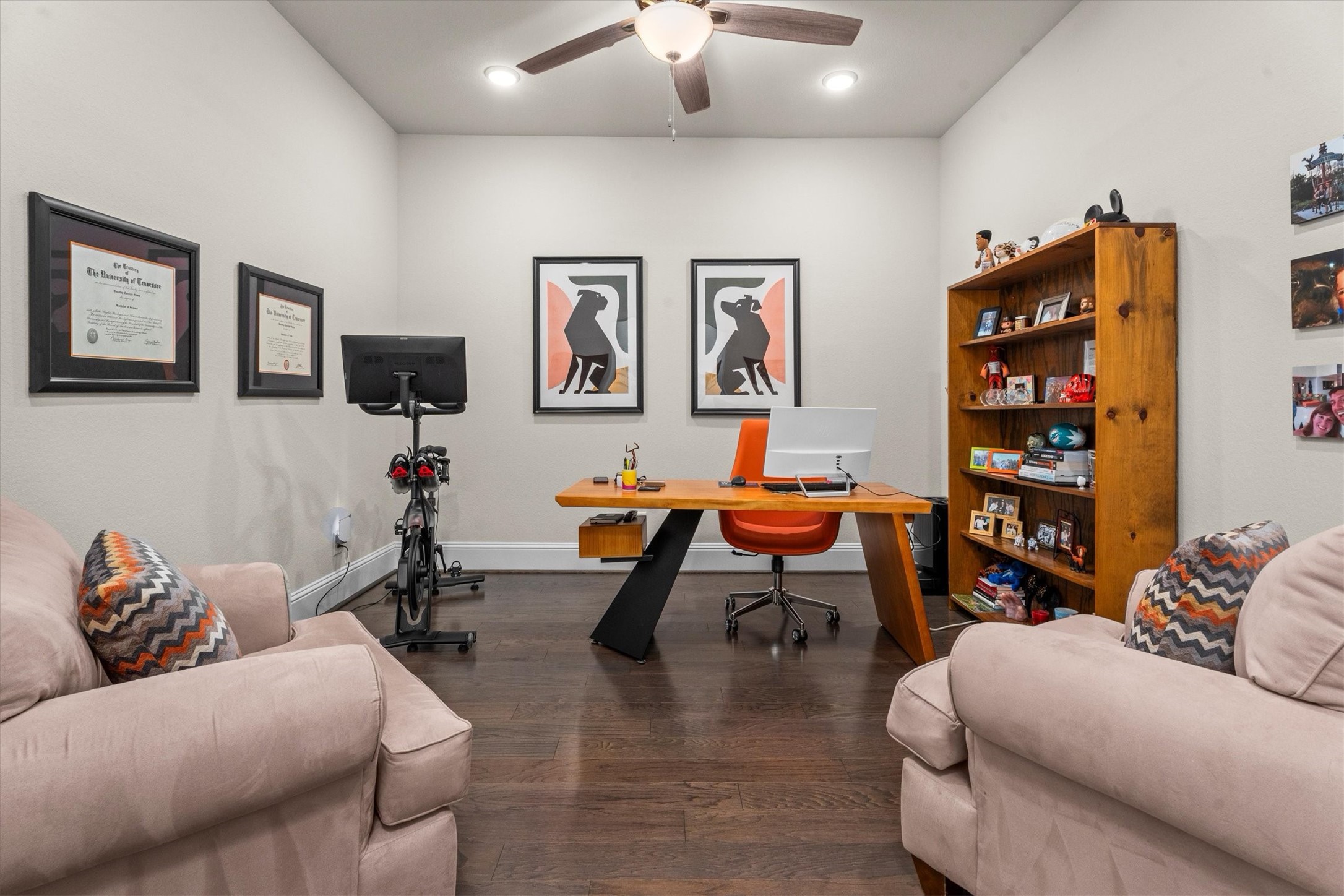 106 Amber Jade Court Conroe, TX 77304 - Photo 5 of 50 a living room with furniture a rug and a bookshelf