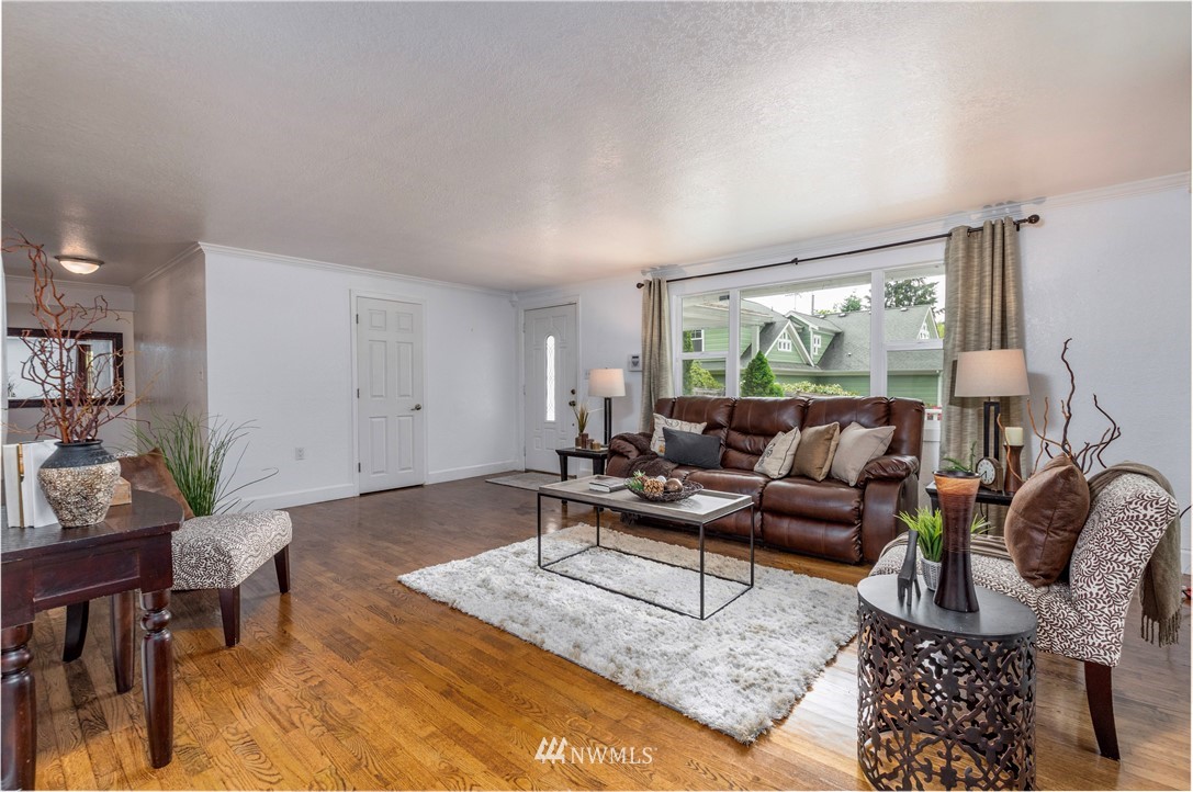 2107 Crystal Springs Road University Place, WA 98466 - Photo 12 of 23 a living room with furniture and a large window