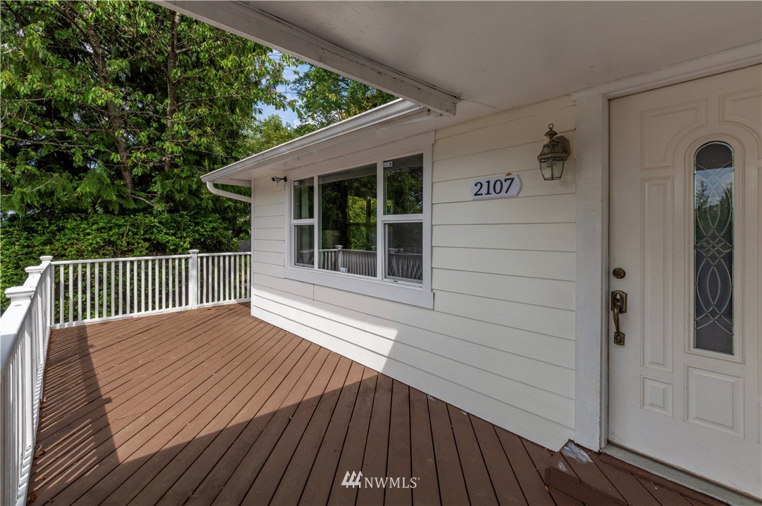 2107 Crystal Springs Road University Place, WA 98466 - Photo 20 of 23 a view of deck with wooden floor and fence