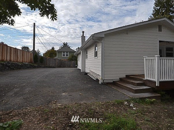 2107 Crystal Springs Road University Place, WA 98466 - Photo 21 of 23 a view of a backyard with a small cabin