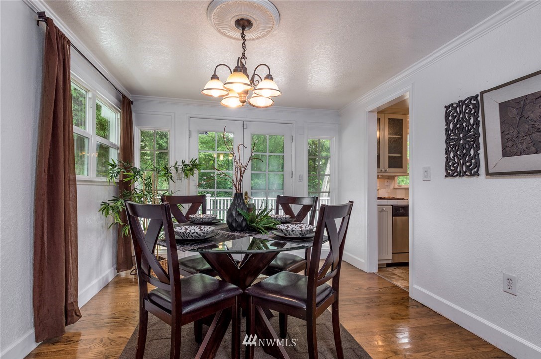 2107 Crystal Springs Road University Place, WA 98466 - Photo 10 of 23 a view of a dining room with furniture window and wooden floor