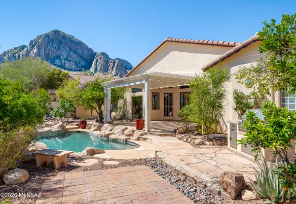 a backyard of a house with yard and outdoor seating
