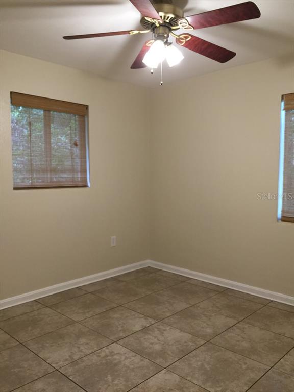 631 Northwest 34th Terrace Gainesville, FL 32607 - Photo 11 of 14 a view of an empty room with a window