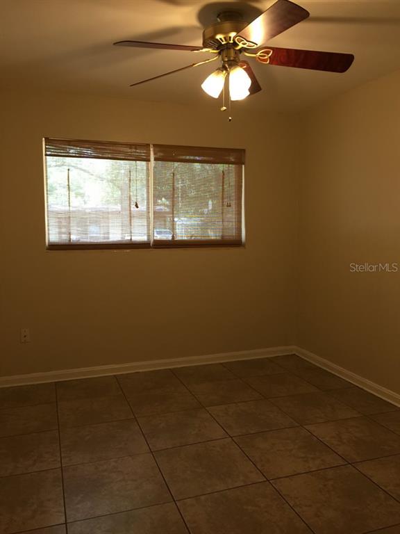 631 Northwest 34th Terrace Gainesville, FL 32607 - Photo 13 of 14 a view of an empty room with a window