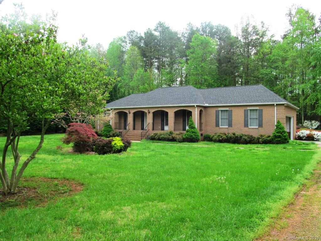 205 Timberfield Trail, Unit 76 China Grove, NC 28023 - Photo 1 of 8 a aerial view of a house next to a yard with green space