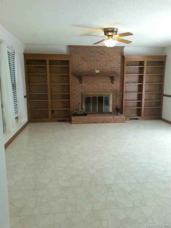 205 Timberfield Trail, Unit 76 China Grove, NC 28023 - Photo 5 of 8 a view of an empty room with a fireplace