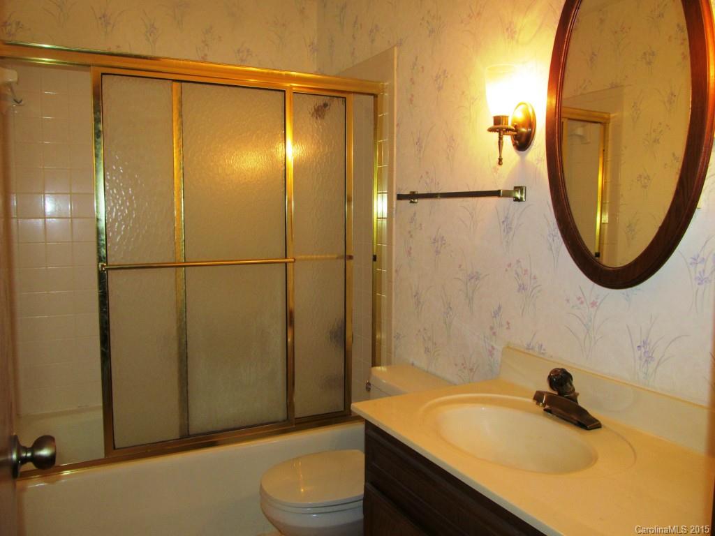 205 Timberfield Trail, Unit 76 China Grove, NC 28023 - Photo 8 of 8 a bathroom with a sink and a mirror