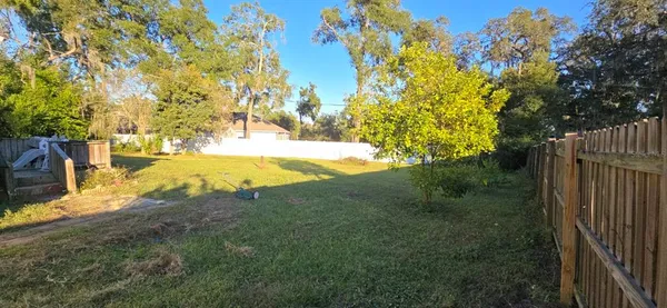 a view of a yard with an outdoor space