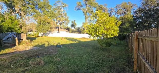 a view of a yard with an outdoor space