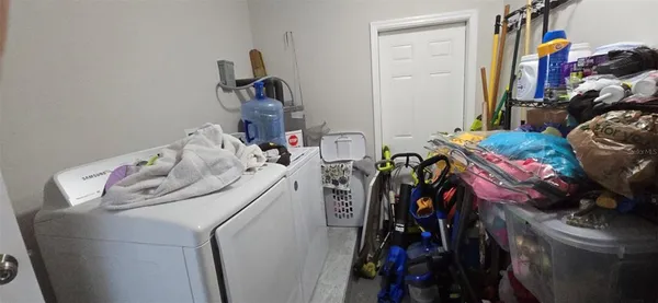 a utility room with dryer and washer