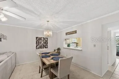 a view of a dining room with furniture and window