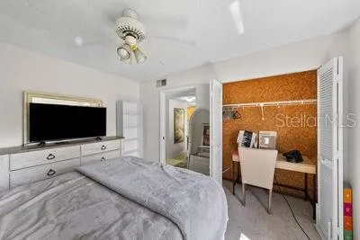 a bathroom with a sink a toilet and shower curtain