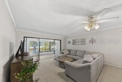 a living room with furniture and a large window