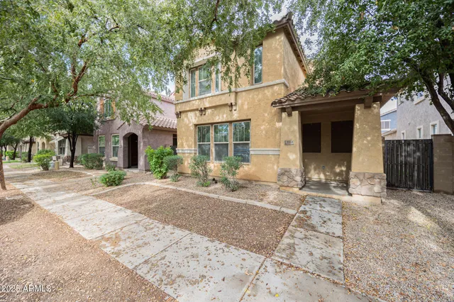 a front view of a house with yard and seating area